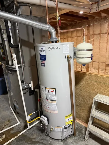 40-gallon water heater installed by Poor John's Plumbing in Parkville, with copper piping and an expansion tank